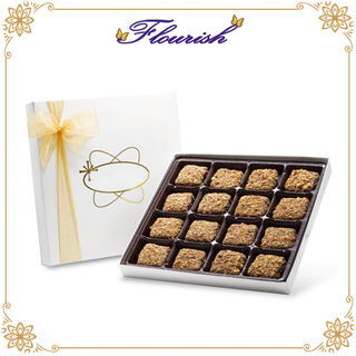 Contenitore di regalo di cioccolato bianco di carta patinata con nastro giallo