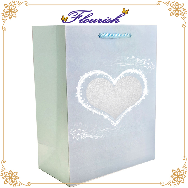 Sacchetto regalo per feste in carta patinata blu chiaro con lamina d'argento